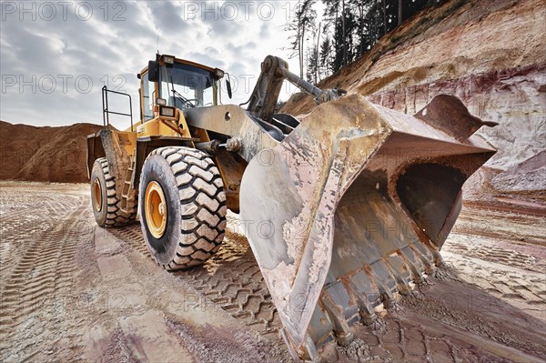 Shovel excavator in kaolin pit