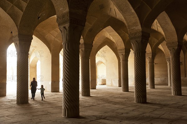 Mother with child in Vakil Mosque prayer hall