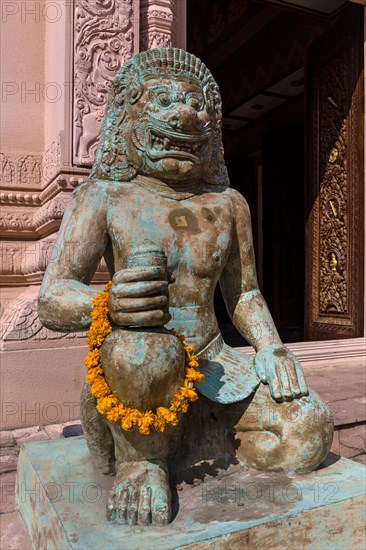 Khmer style demon statue at city column entrance