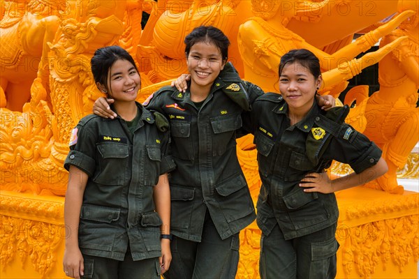 Female soldiers of the Thai Army in front of monument in Wat Phra That Nong Bua