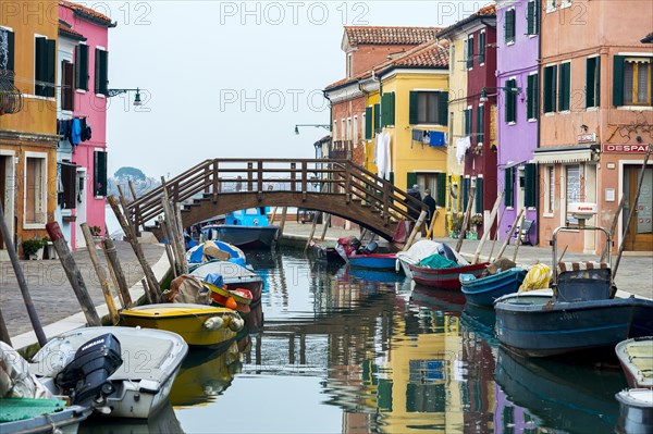 Colorful houses on canal with boats