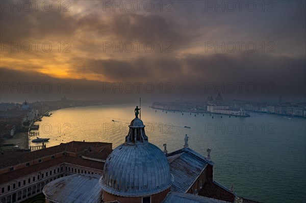 View of Church of San Giorgio Maggiore to Basilica di Santa Maria della Salute at sunset