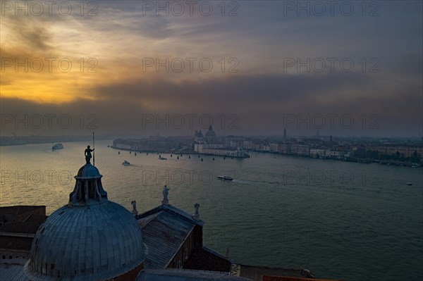 View of Church of San Giorgio Maggiore to Basilica di Santa Maria della Salute at sunset