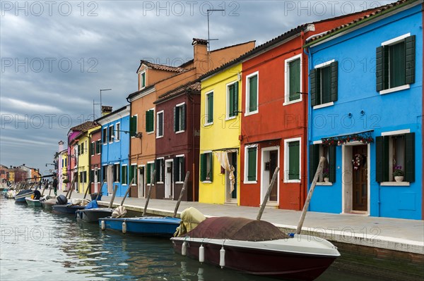 Colorful houses on canal with boats