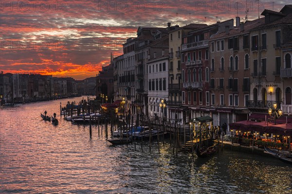 Houses and gondolas on Grand Canal at sunset