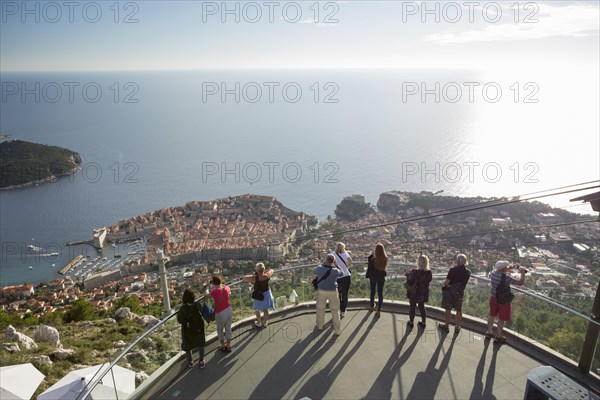People enjoying the view of Dubrovnik from the viewing platform on Mount Srd