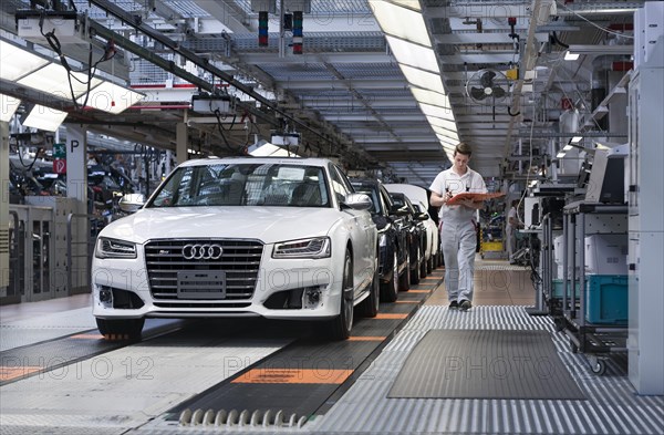 Audi AG employee conducting the first run of an assembled A8 sedan