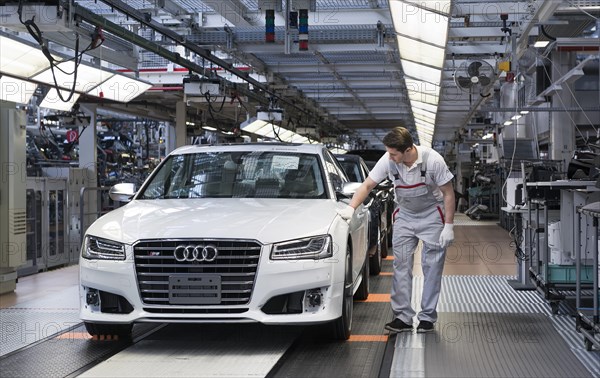 Audi AG employee conducting the first run of an assembled A8 sedan