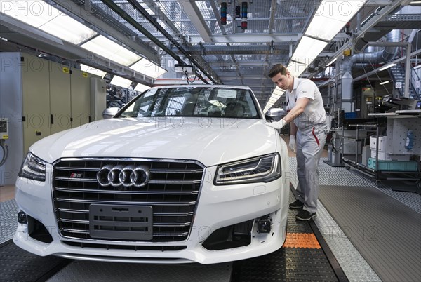 Audi AG employee conducting the first run of an assembled A8 sedan