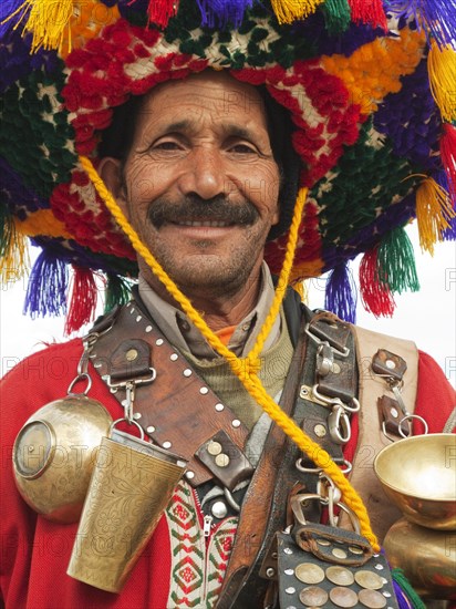 The water sellers at the Jemaa el-Fnaa square in Marrakesh are making a living from posing for photographs