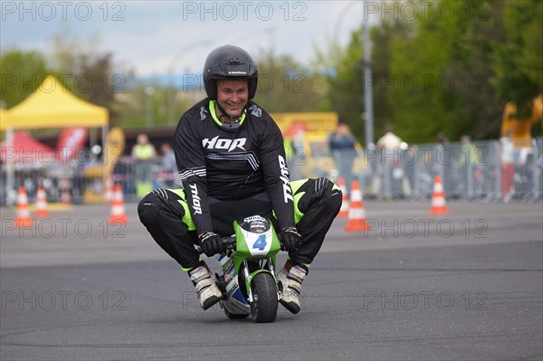 Motorcycle stuntman Mike Auffenberg on a minibike during the ADAC motorbike startup day