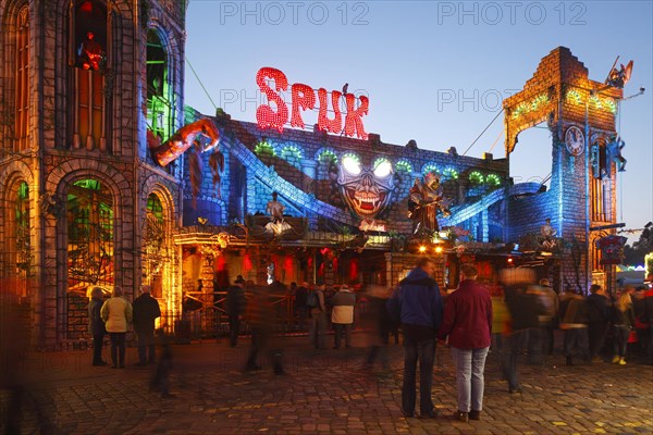 Ghost train Spuk on the fun fair Bremer Freimarkt at dusk