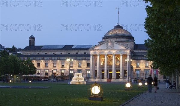 Spa hotel with fountain and park Bowling Green at dusk