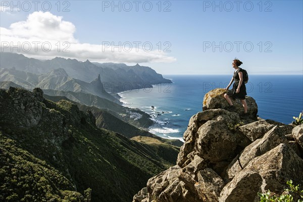 Hiker overlooking the coast in the Anaga Mountains in Benijo