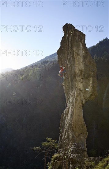 Sport climber on a rocky pinnacle