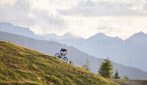 Mountain biker on the descent on a fire road