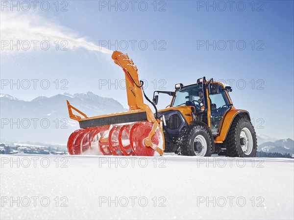 Snowplow with snowblower clearing snow