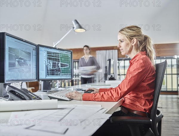 Architect sitting at the computer at work