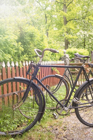 Rural scene with old retro bikes in a bicycle rack