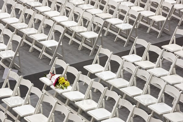 A bundle of flowers on a chair before the graduation ceremony at the University of Detroit Mercy School of Law
