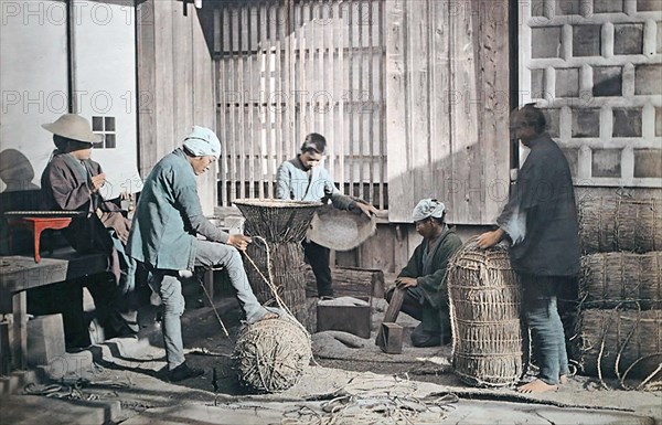 Farmers producing rice bundles