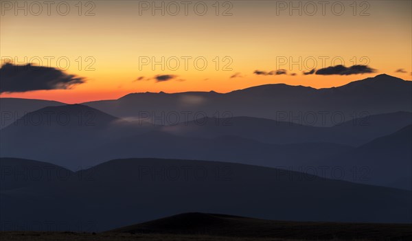 Views of the Sibillini Mountains at sunrise from Monte Serrasanta