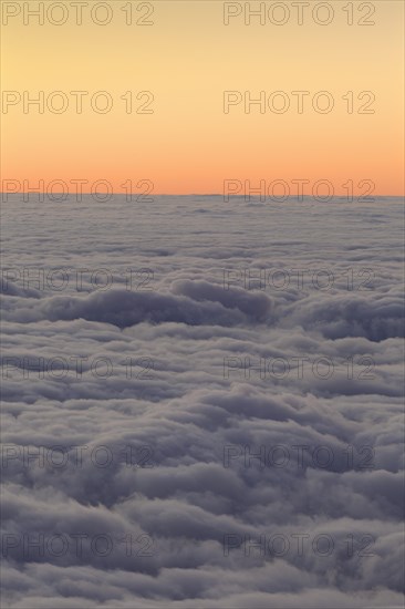 Sunset above the clouds