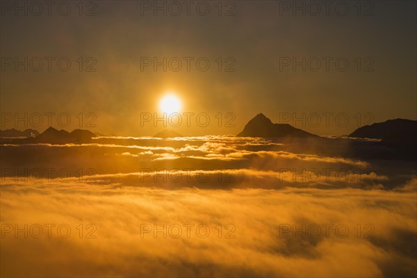 Sunrise on Jochberg mountain with cloud cover