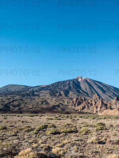 Pico del Teide or Mount Teide with the rock formation Roques de Garcia