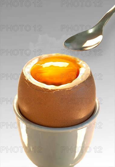 Soft-boiled egg with a spoon