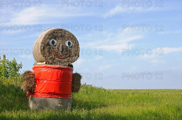 Straw doll made of straw bales