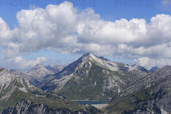 Lechquellen Mountains with Spuller Schafberg mountain and lake Spullersee seen from Burtschakopf mountain