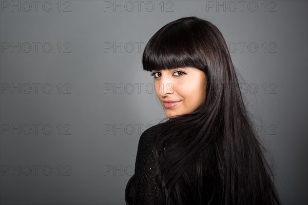 Woman looking over her shoulder