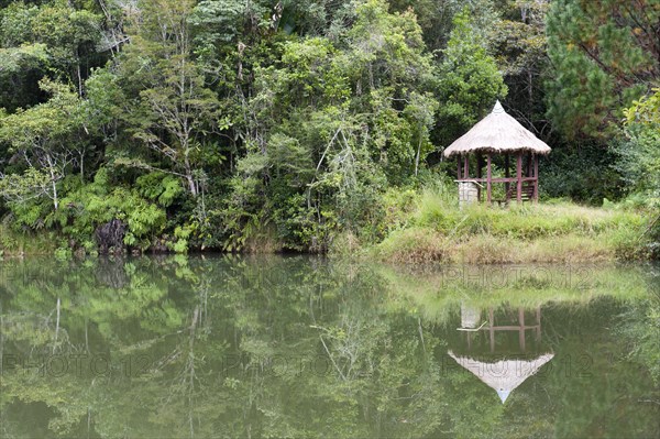 Cottage reflected in a lake