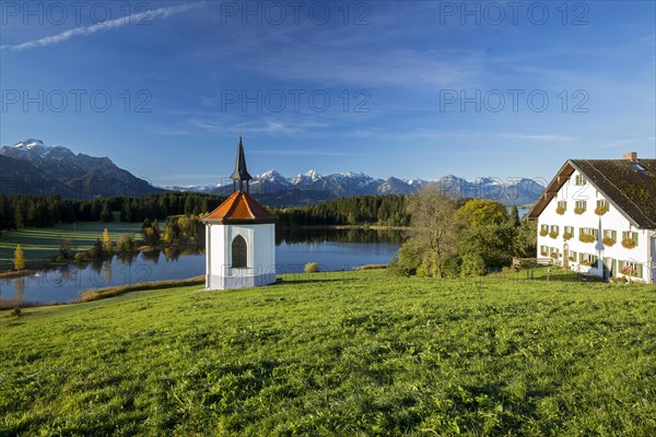Chapel at Hegratsrieder See lake on an autumn morning