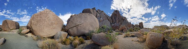 Granite rocks of Split Rocks with cumulus clouds