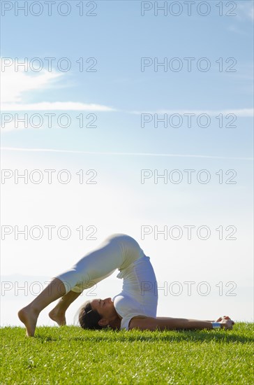 Young woman practising Hatha yoga