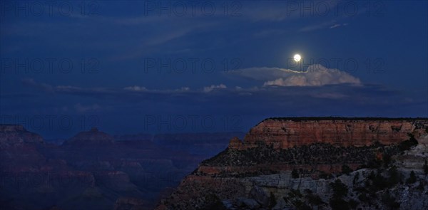 View of the Grand Canyon at night with full moon