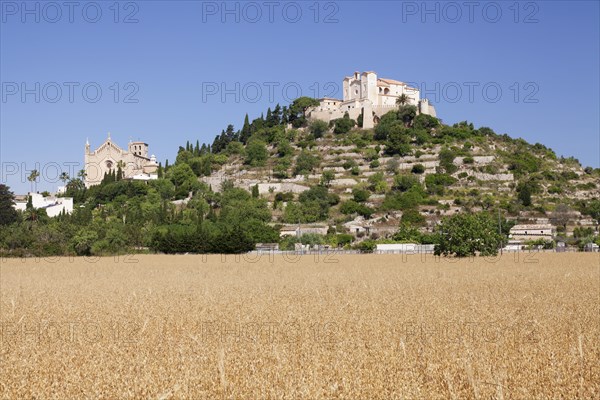 Parish church Transfiguracio del Senyor and the pilgrimage church of Sant Salvador on Calvary Hill or Puig de Sant Salvador