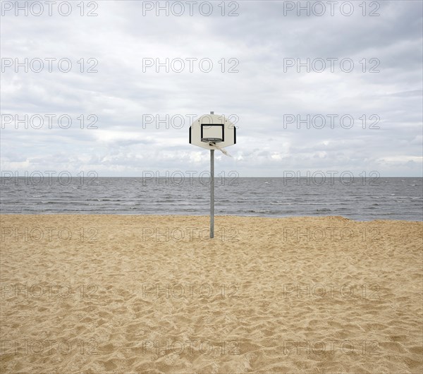 Basketball hoop on a deserted North Sea beach