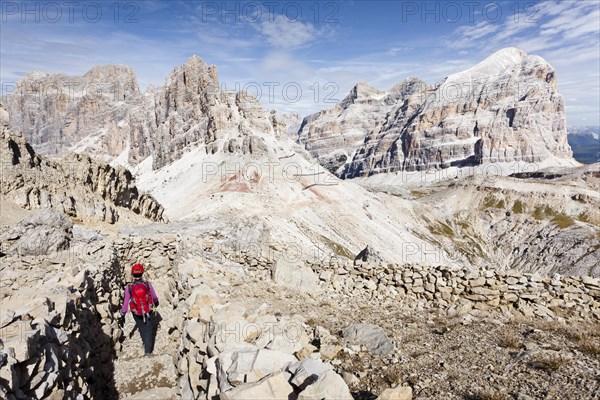 Climbers descending from Lagazuoi over the Galleria Lagazuoi in the Fanesgroup at the Falzarego Pass