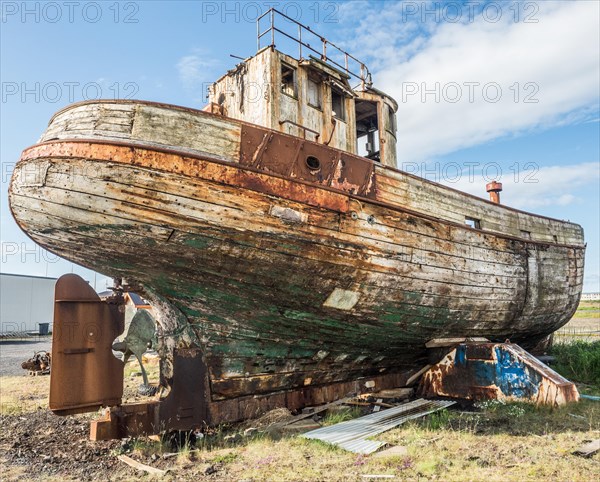 Old fishing boat on land