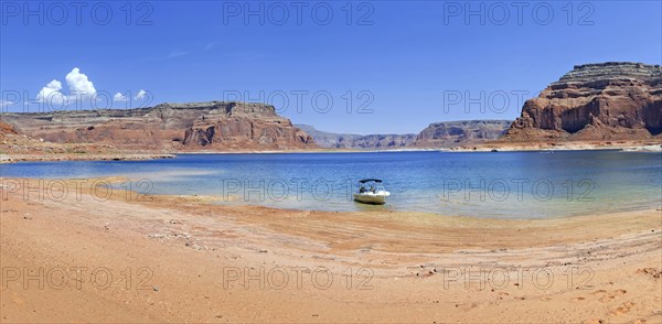 Small boat on the shore of Lake Powell