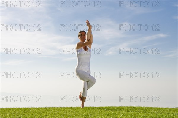 Young woman practising Hatha yoga