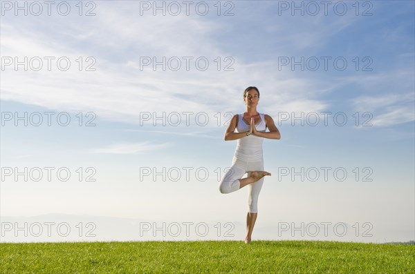 Young woman practising Hatha yoga