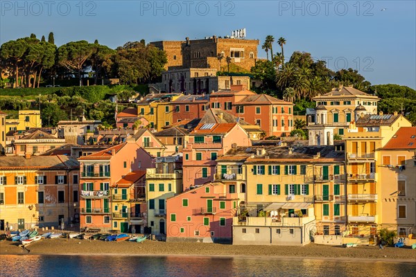 Colourful houses along Baia del Silenzio