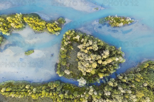 Wooded small islands in the Isar reservoir Tolz