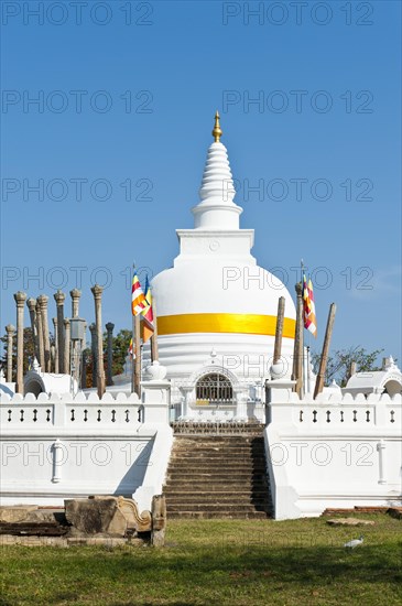 Old white stupa with orange ribbon