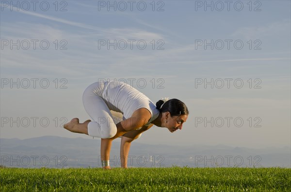 Young woman practising Hatha yoga