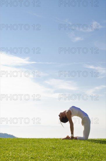 Young woman practising Hatha yoga